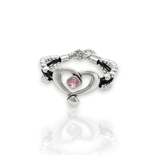 Pulsera de cuero y bolasde plata con corazón hueco y cristal de Swarovki rosa, de la marca Maldita Rita.