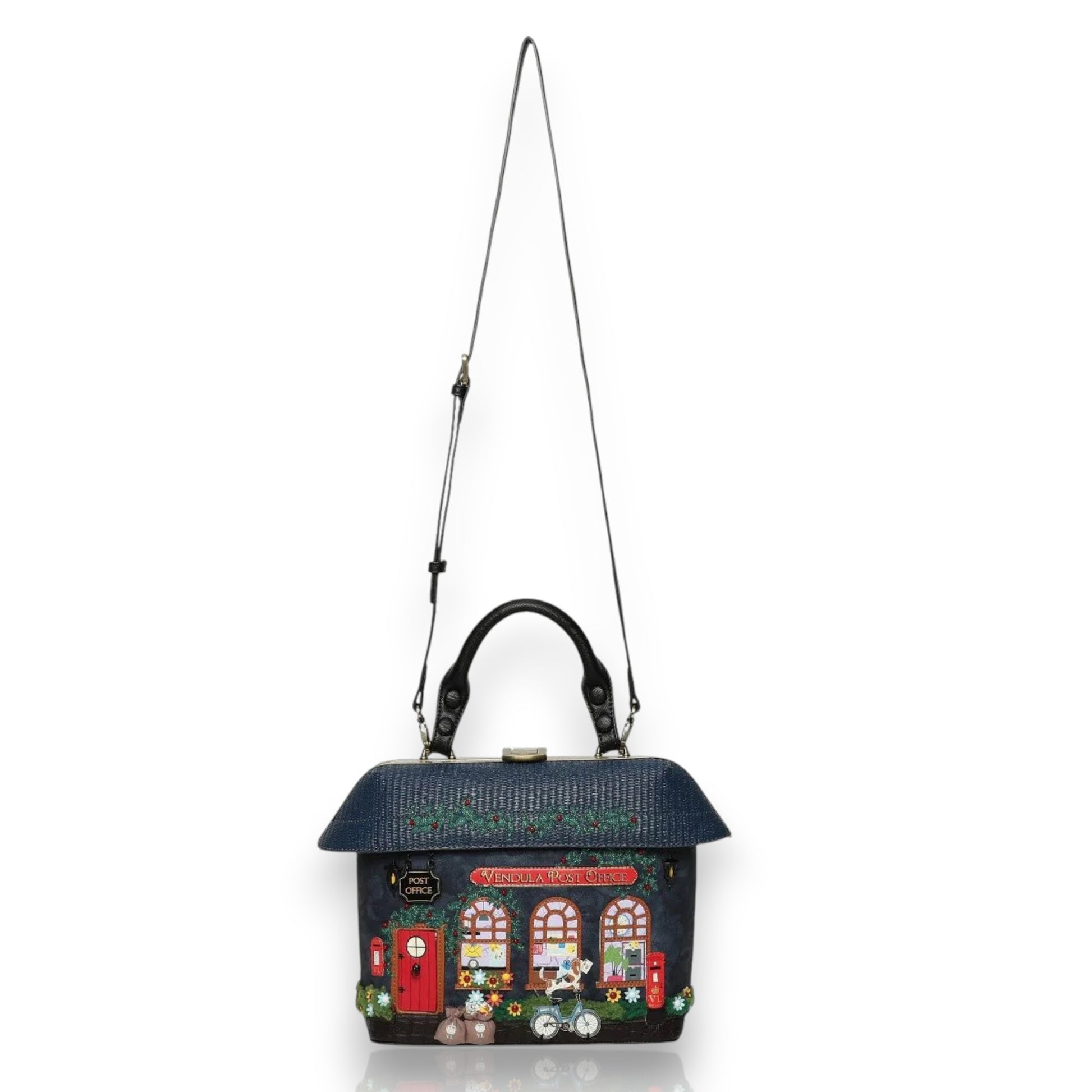 Bolso de mano The old Post Office Navy Edition de Vendula London, venta en Maldita Rita Almería, visto con bandolera.